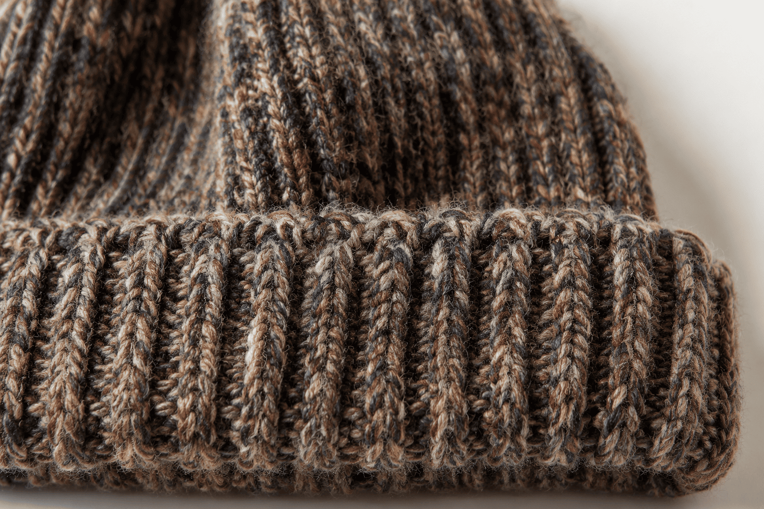 close-up of a knitted beanie texture showing yarn details